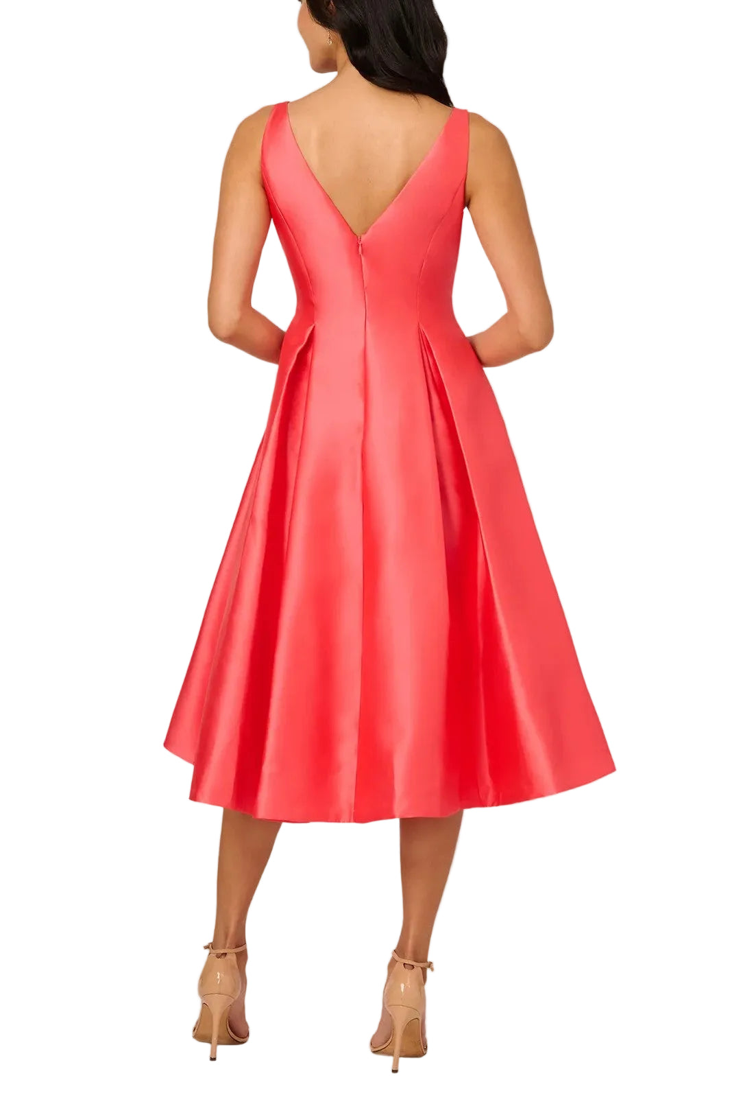 Coral pink dress with a V-neckline on a plain background