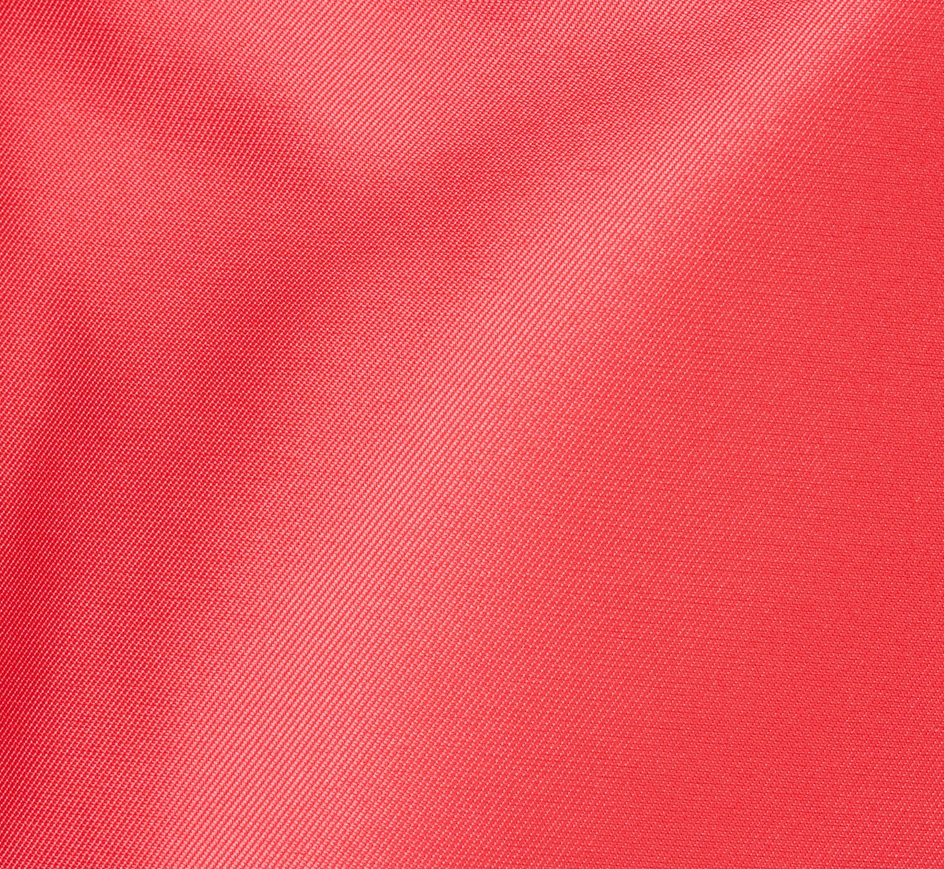 Close-up of a textured red fabric surface