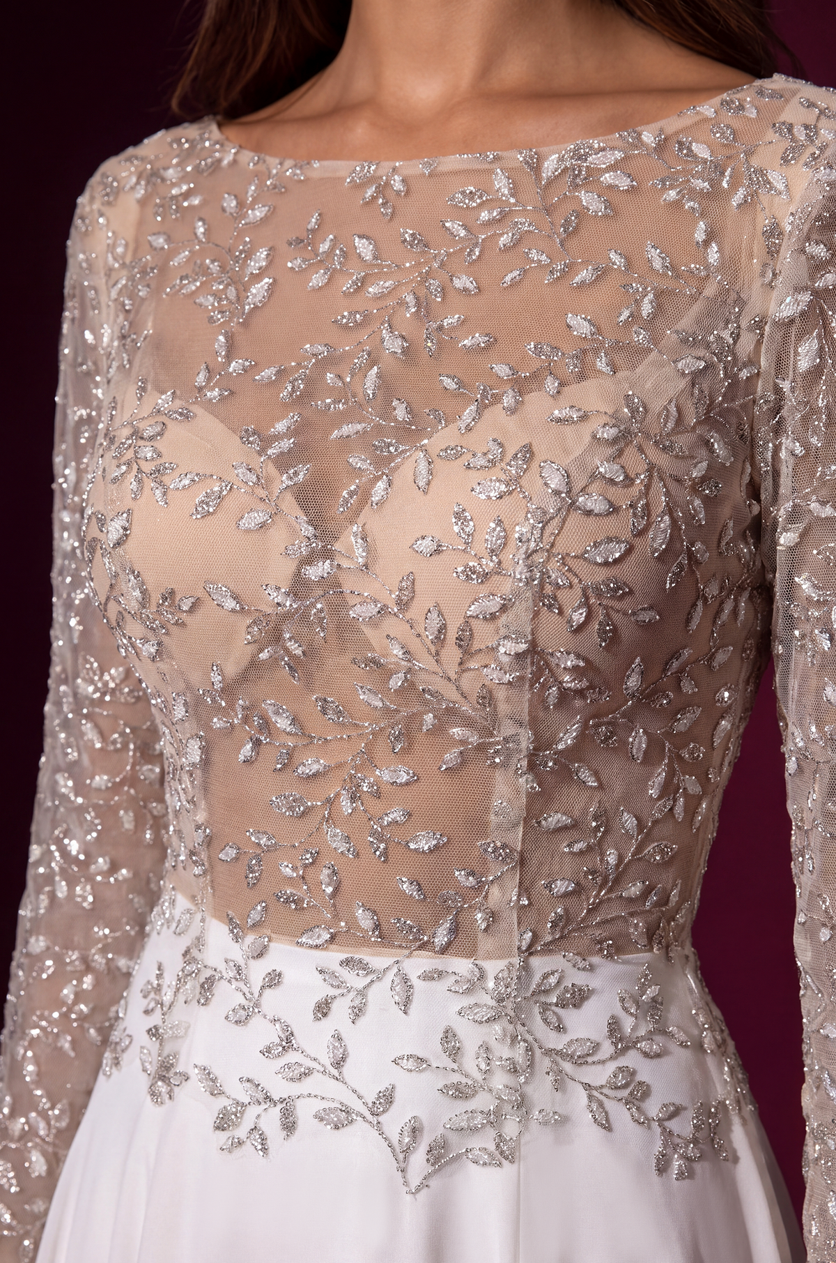 White long-sleeve formal dress, bodice close-up.