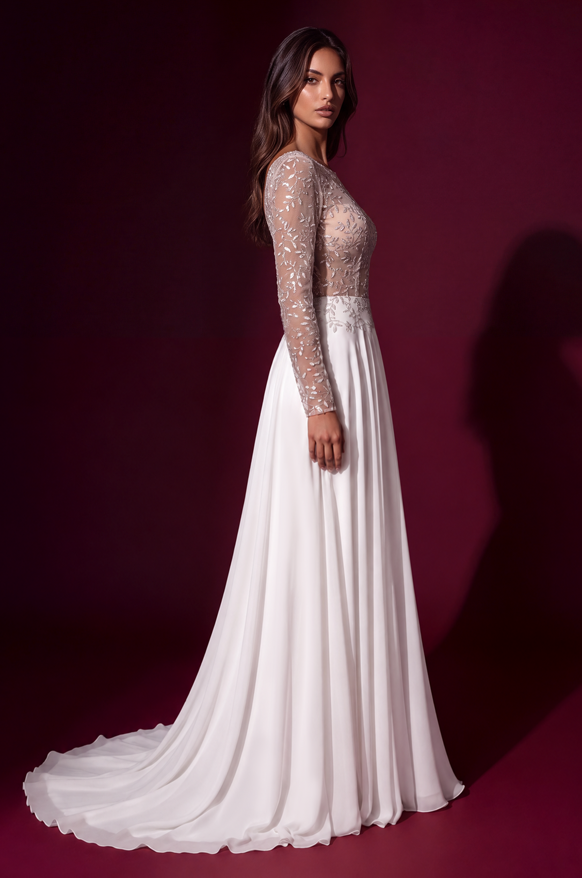 White long-sleeve formal dress, side view.