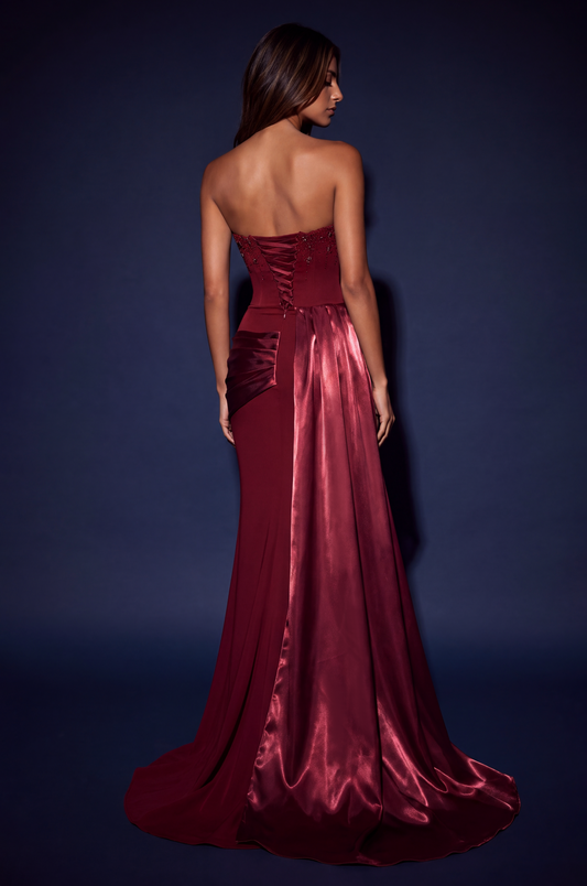 Back view showing the lace-up closure and train