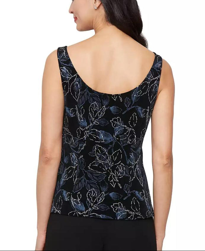 Woman wearing a black floral sleeveless top on a white background