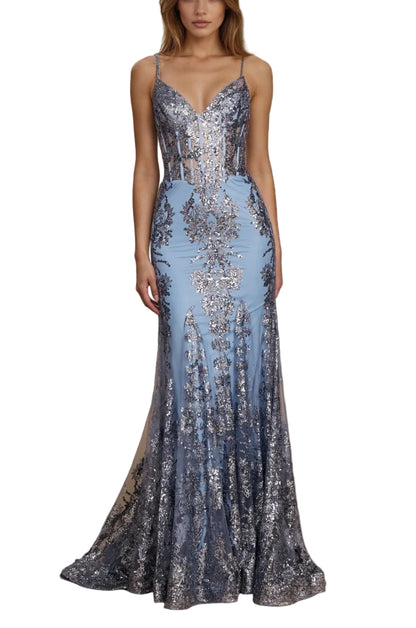 Woman in a sparkling evening gown standing in an outdoor setting with stone arches.