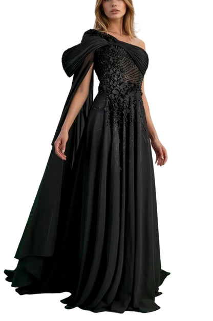 Woman in a black evening gown standing in front of classical architecture