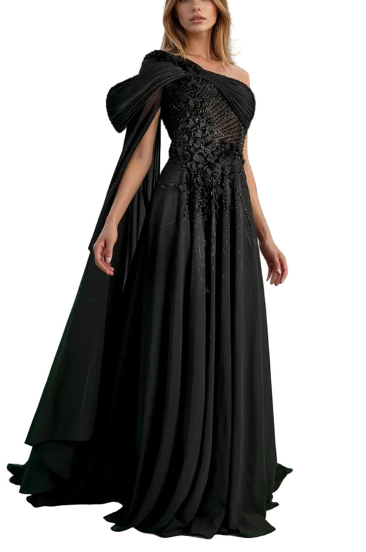 Woman in a black evening gown standing in front of classical architecture