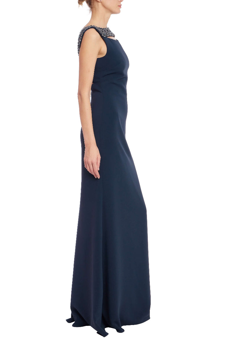 Navy evening gown with beaded neckline on a white background
