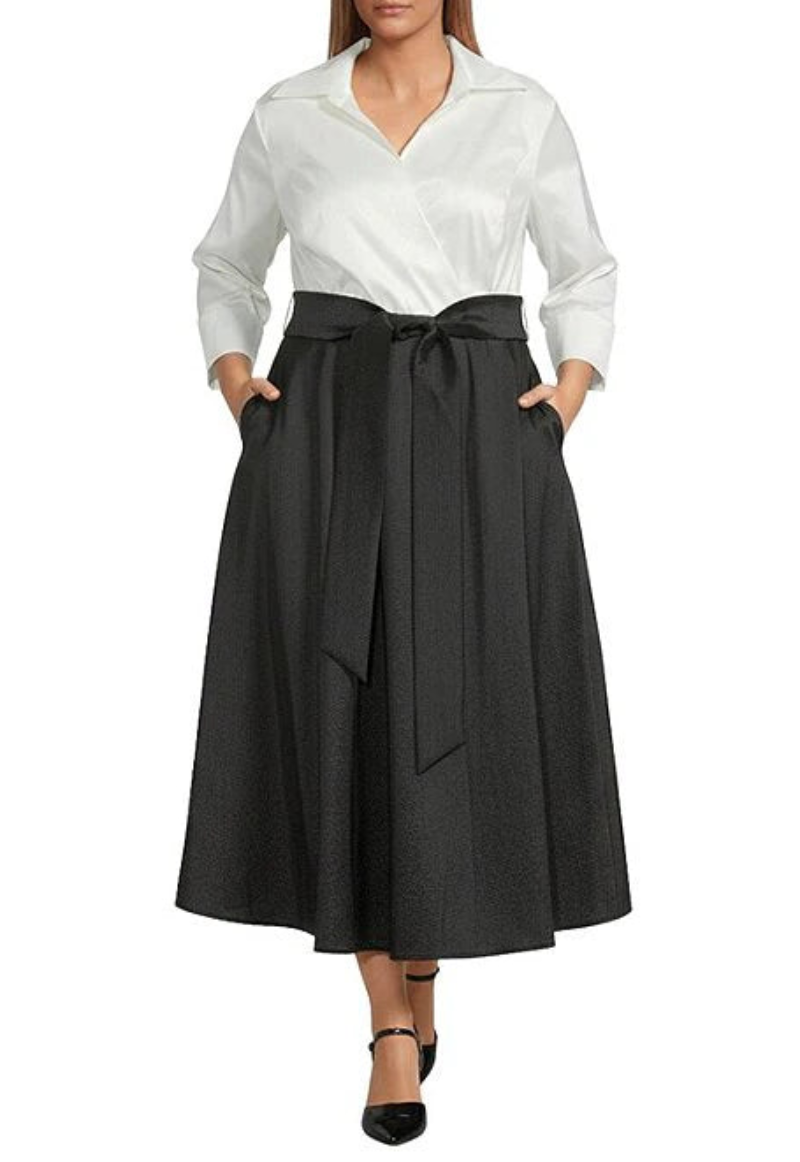 Woman wearing a white blouse and black skirt on a white background