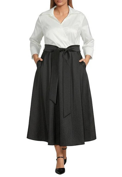 Woman wearing a white blouse and black skirt on a white background