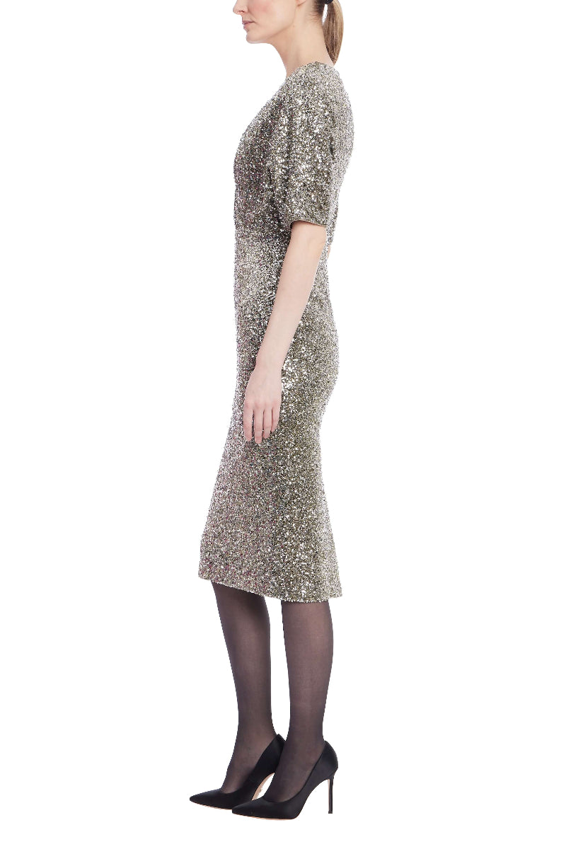 Woman wearing a sequin dress on a white background