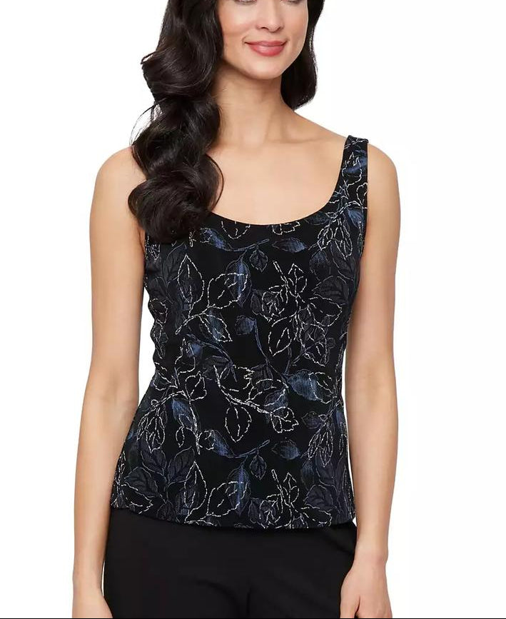 Woman wearing a black floral patterned top on a white background