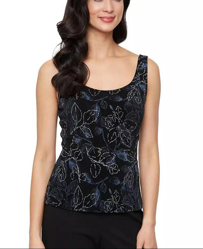 Woman wearing a black floral patterned top on a white background